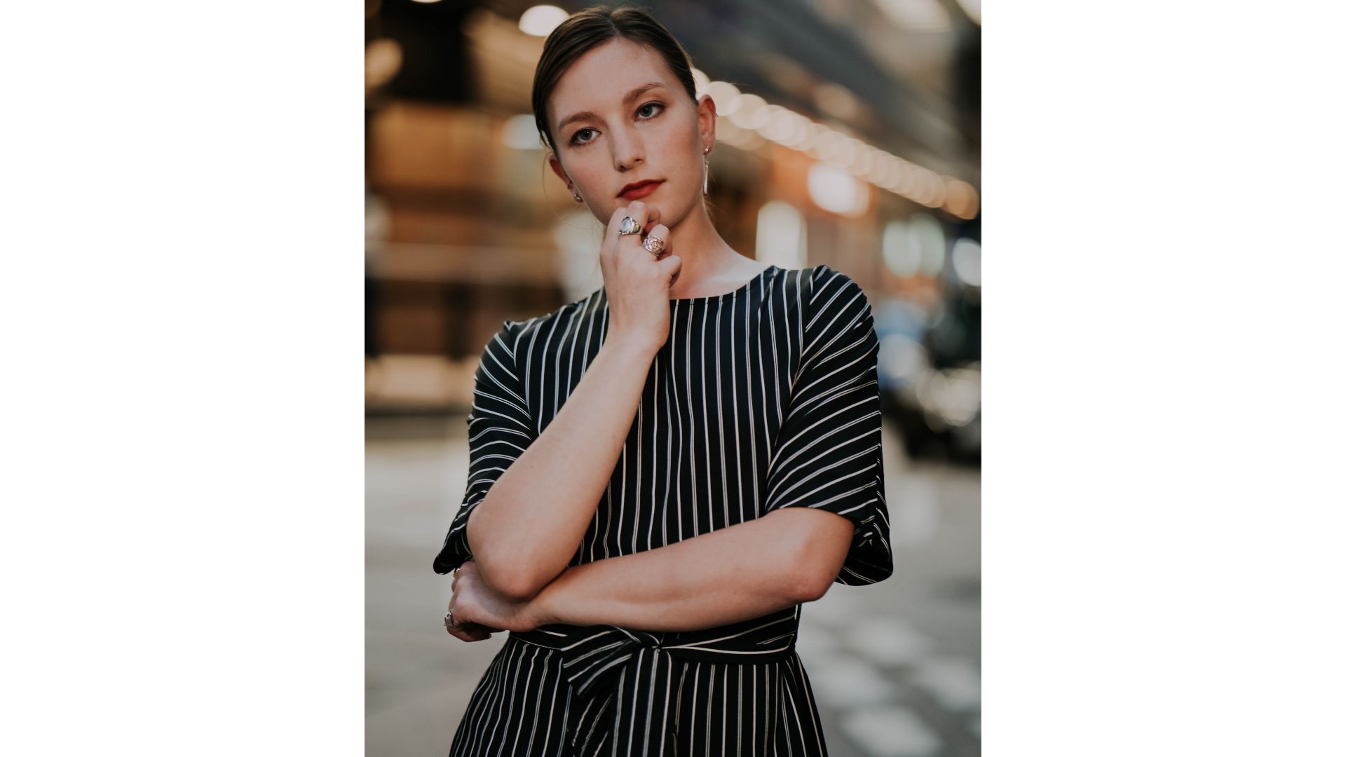 A person in a striped dress

AI-generated content may be incorrect.