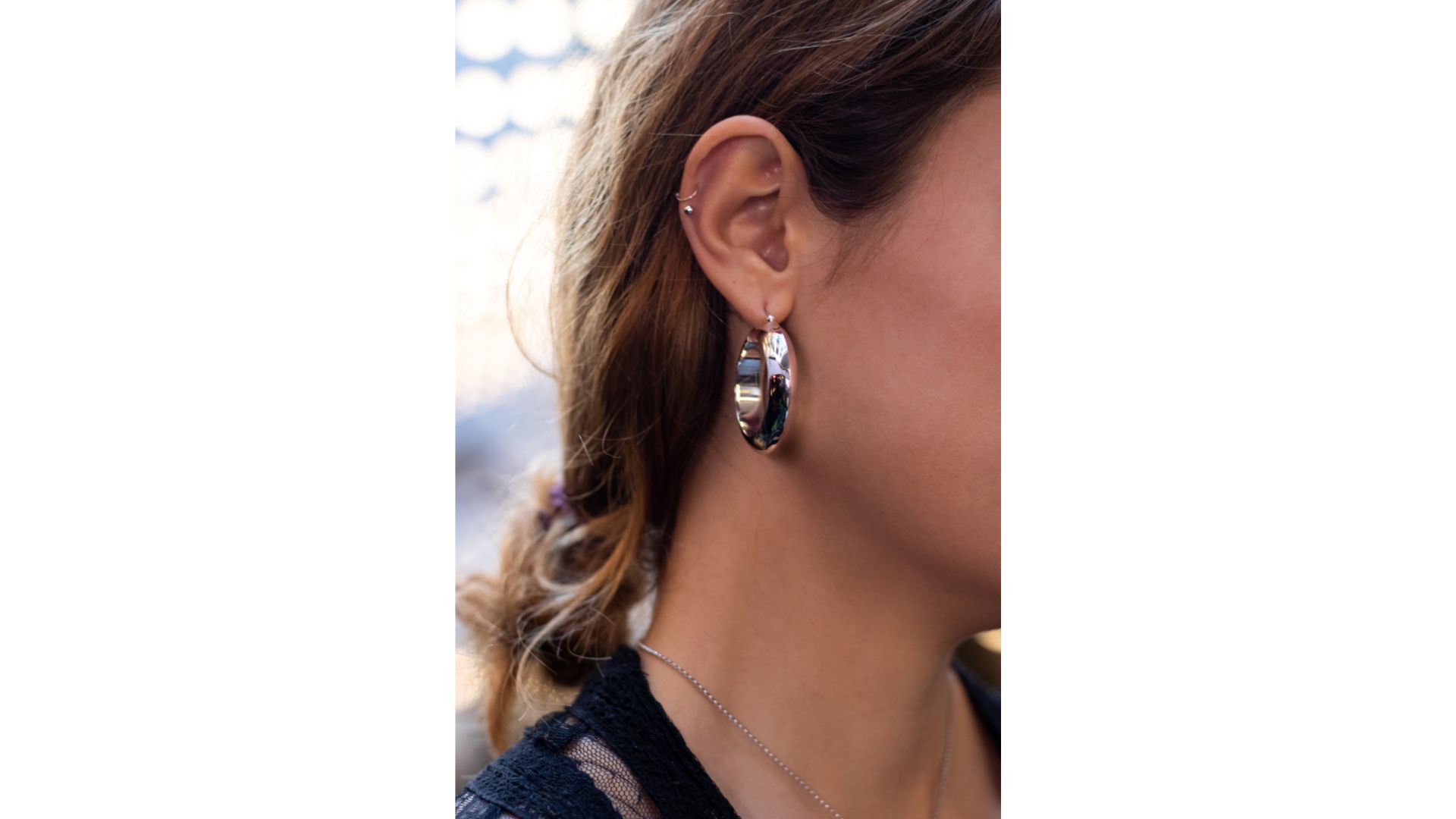 A close-up of a person's ear
Description automatically generated