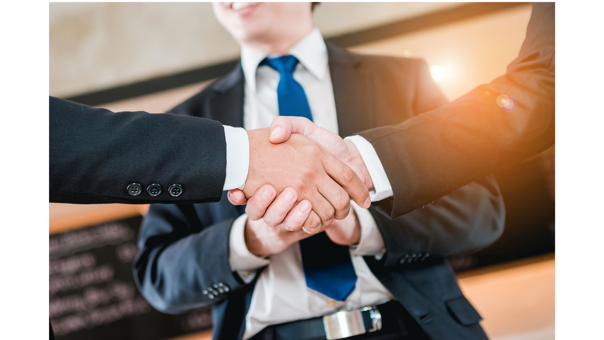 A close-up of people shaking hands
AI-generated content may be incorrect.
