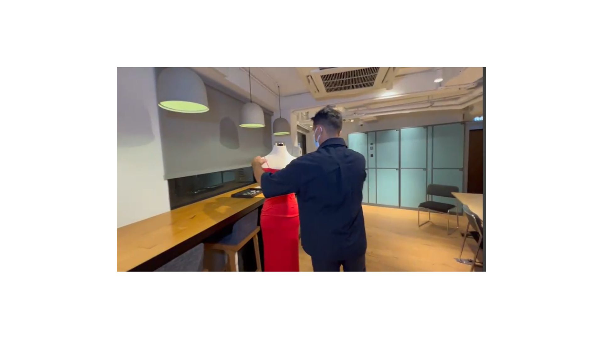 A person in a red dress
Description automatically generated