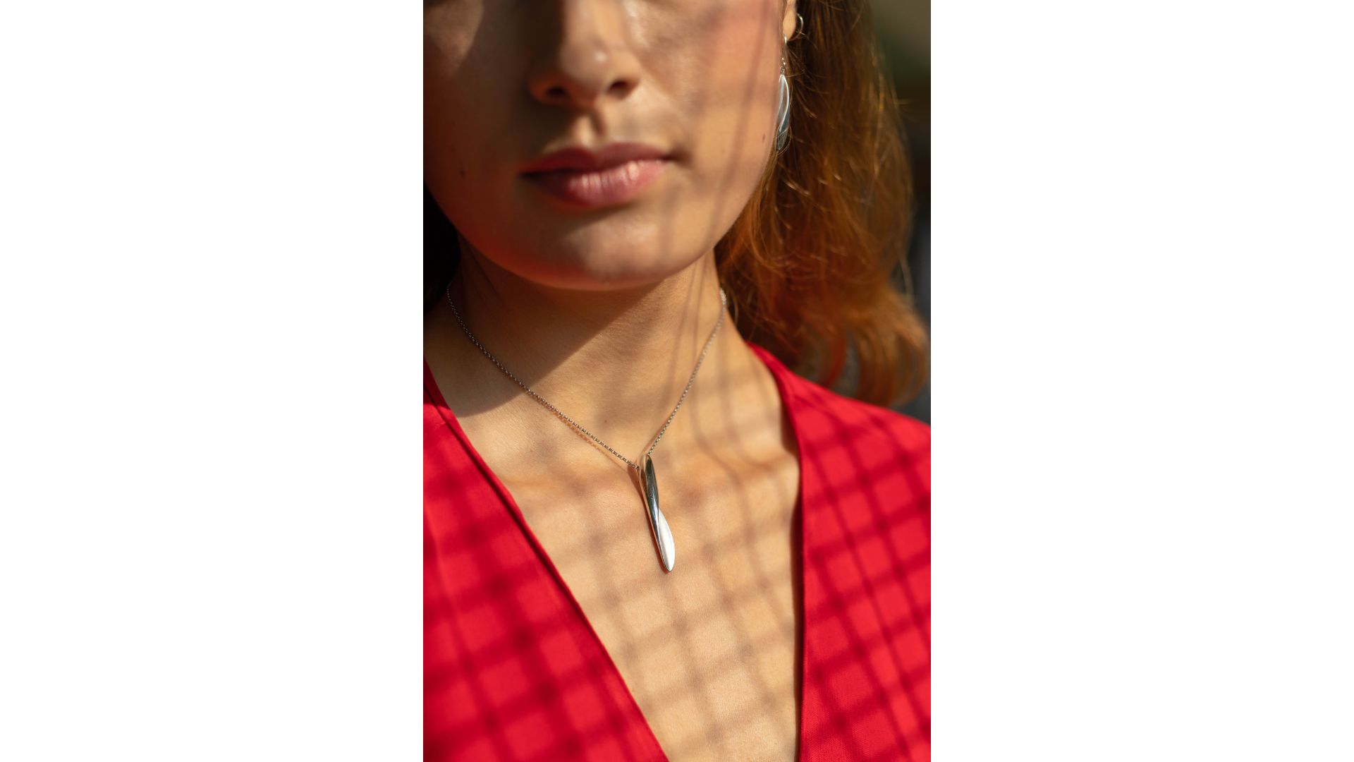 A close-up of a person's neck

Description automatically generated