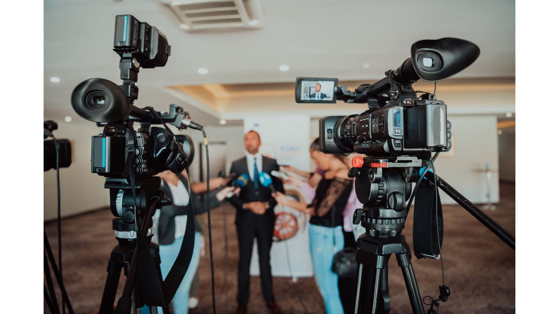 A group of people standing in front of a camera

AI-generated content may be incorrect.