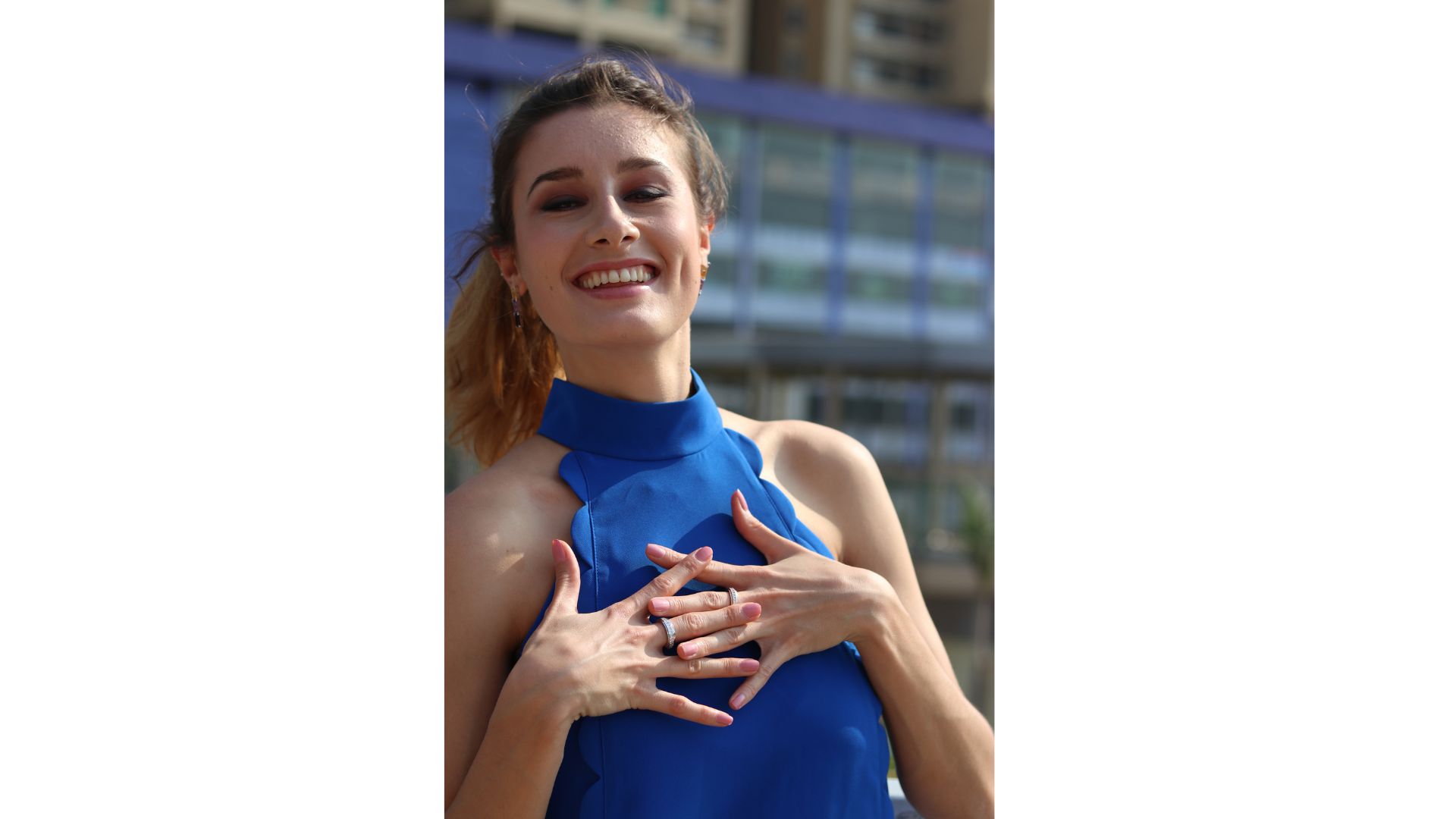 A person holding her hands on her chest
AI-generated content may be incorrect.