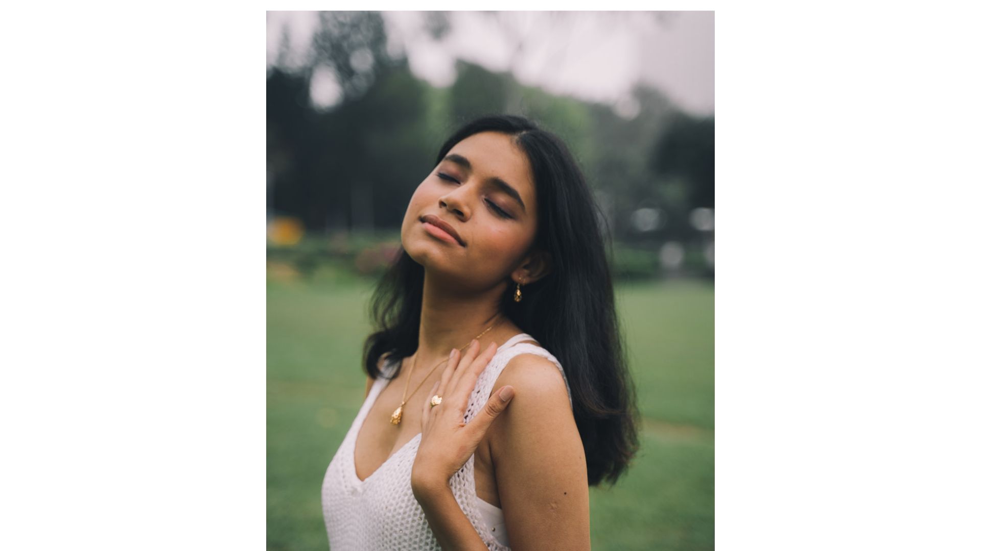 A person with eyes closed
Description automatically generated