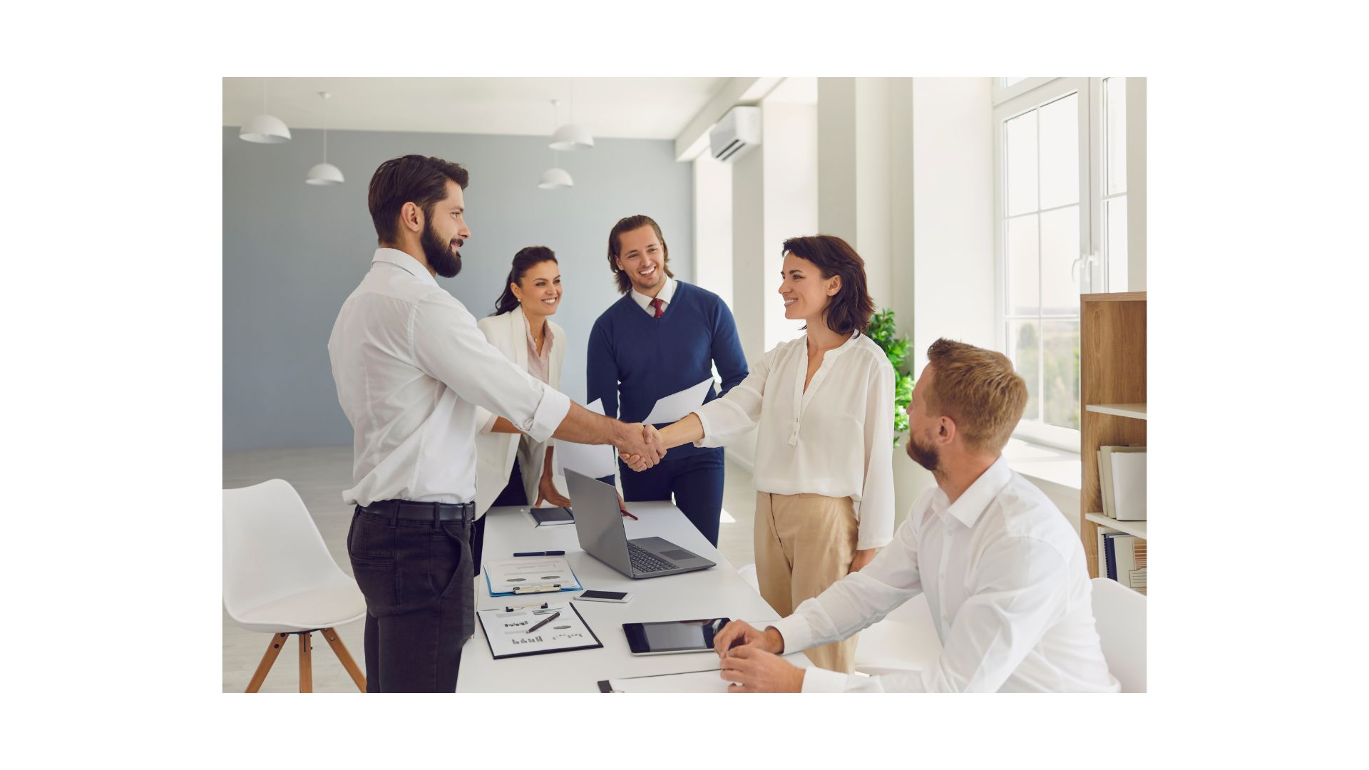 A group of people shaking hands
AI-generated content may be incorrect.