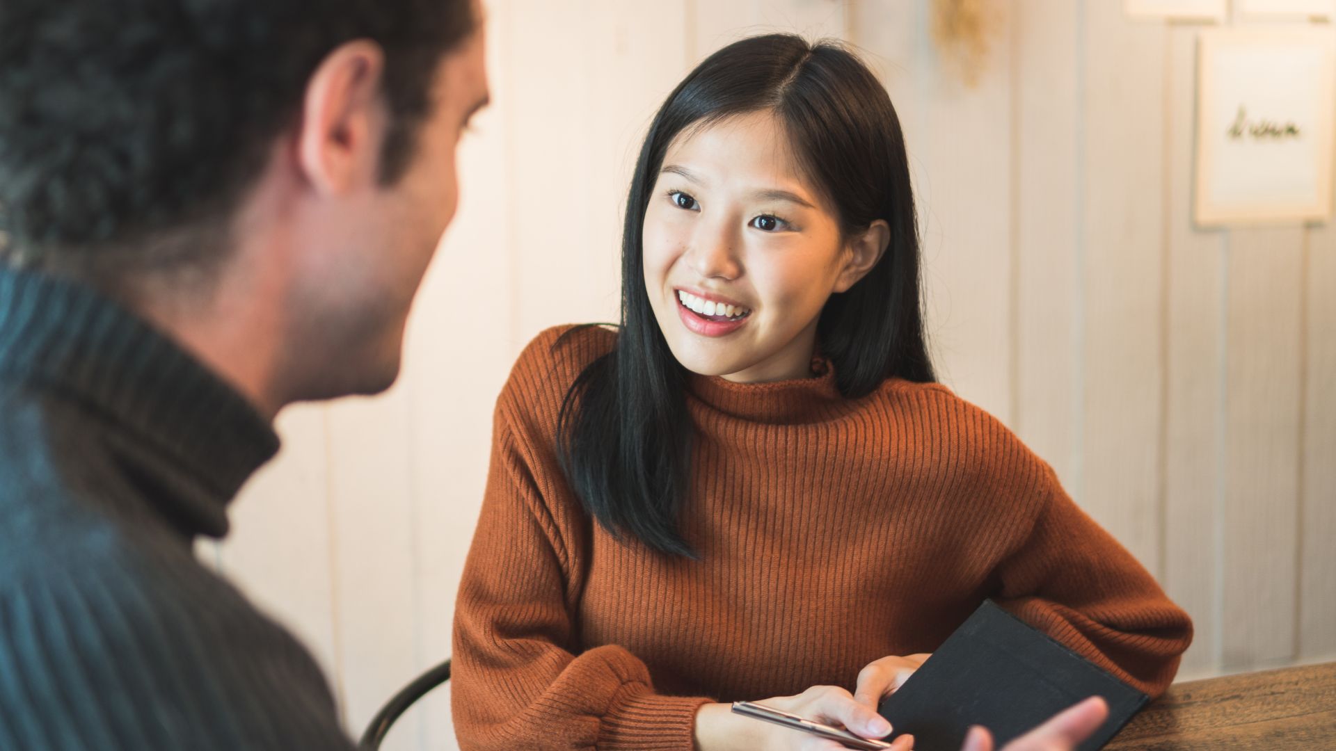 A person smiling at a person

AI-generated content may be incorrect.