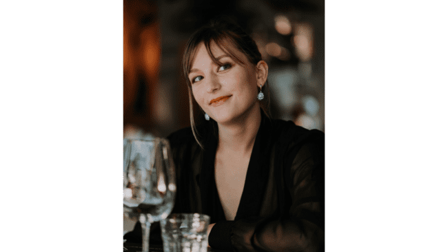 A person sitting at a table

Description automatically generated
