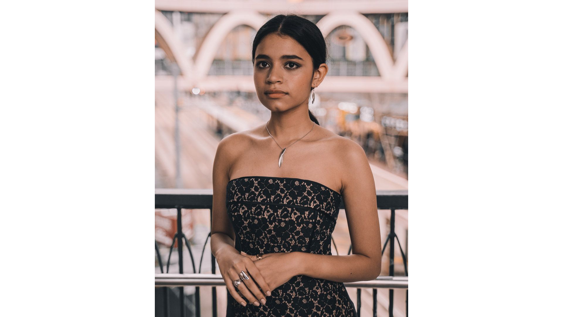 A person in a black dress

Description automatically generated