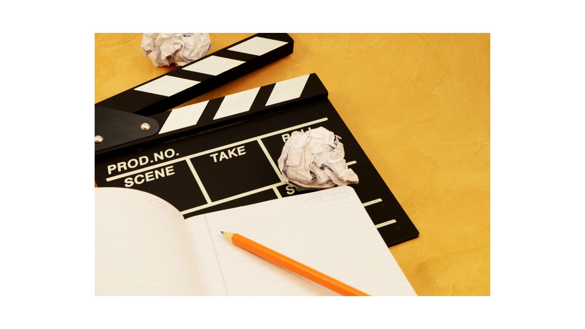 A pencil and a black clapper board
Description automatically generated