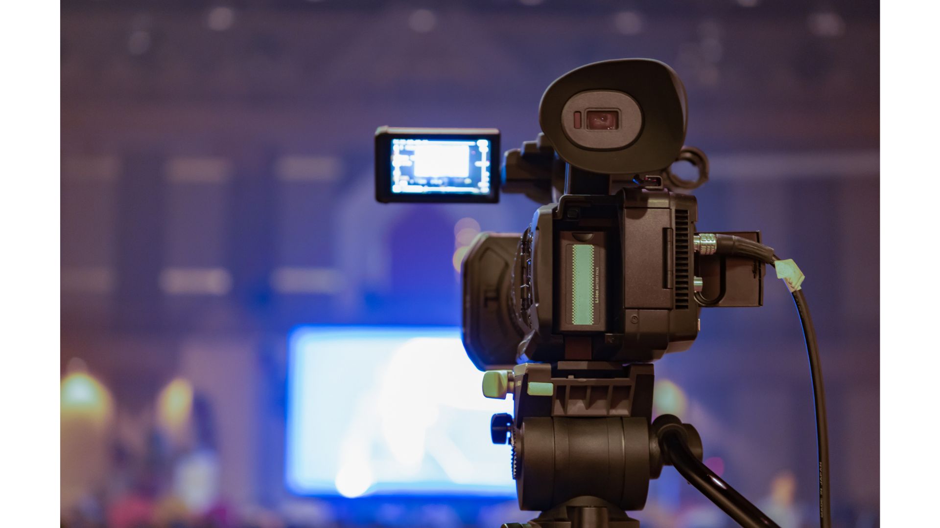 A camera on a tripodundefinedundefinedundefinedundefinedDescription automatically generated