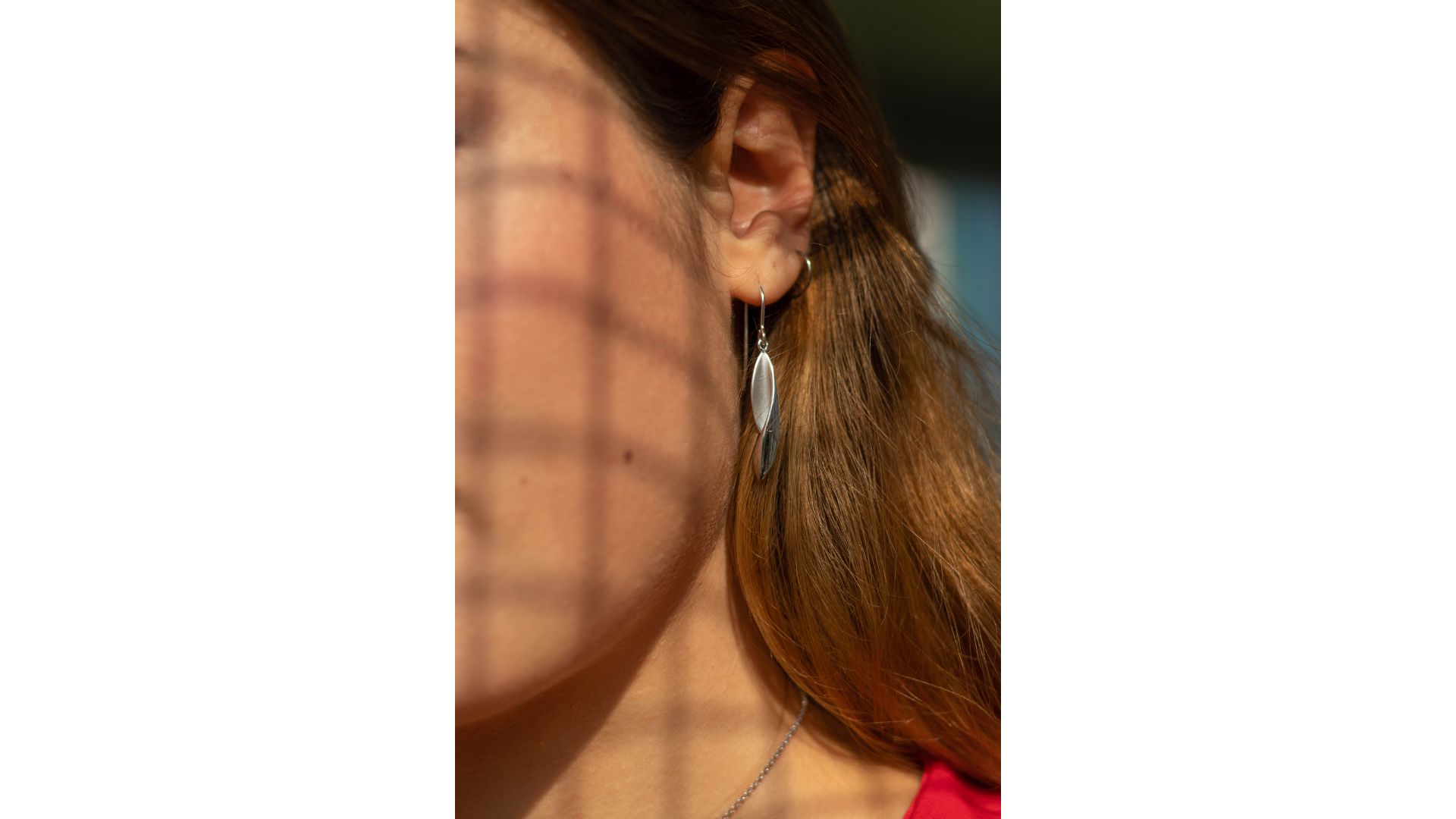 A close up of a person's ear

Description automatically generated
