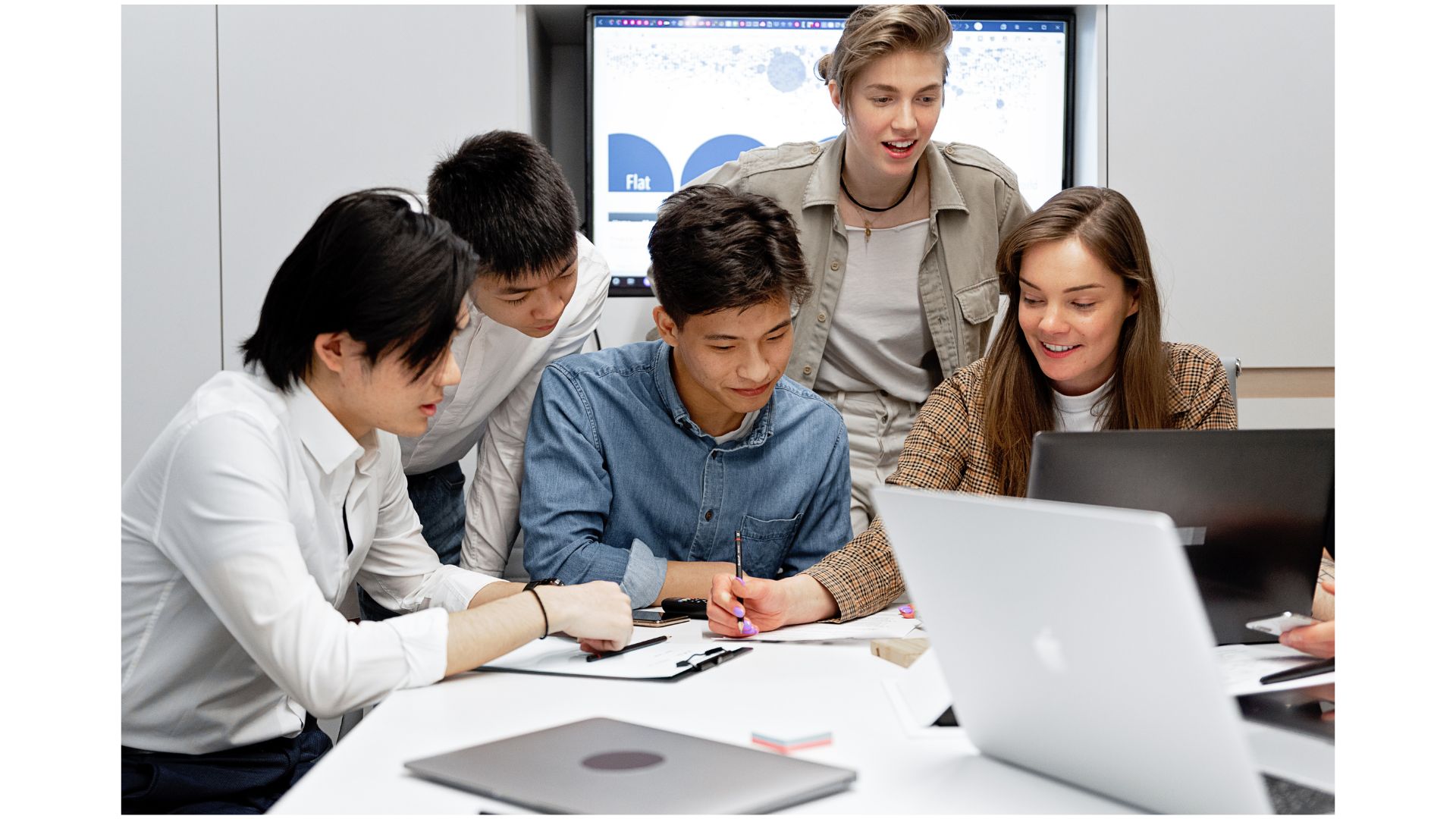 A group of people looking at a computer
AI-generated content may be incorrect.