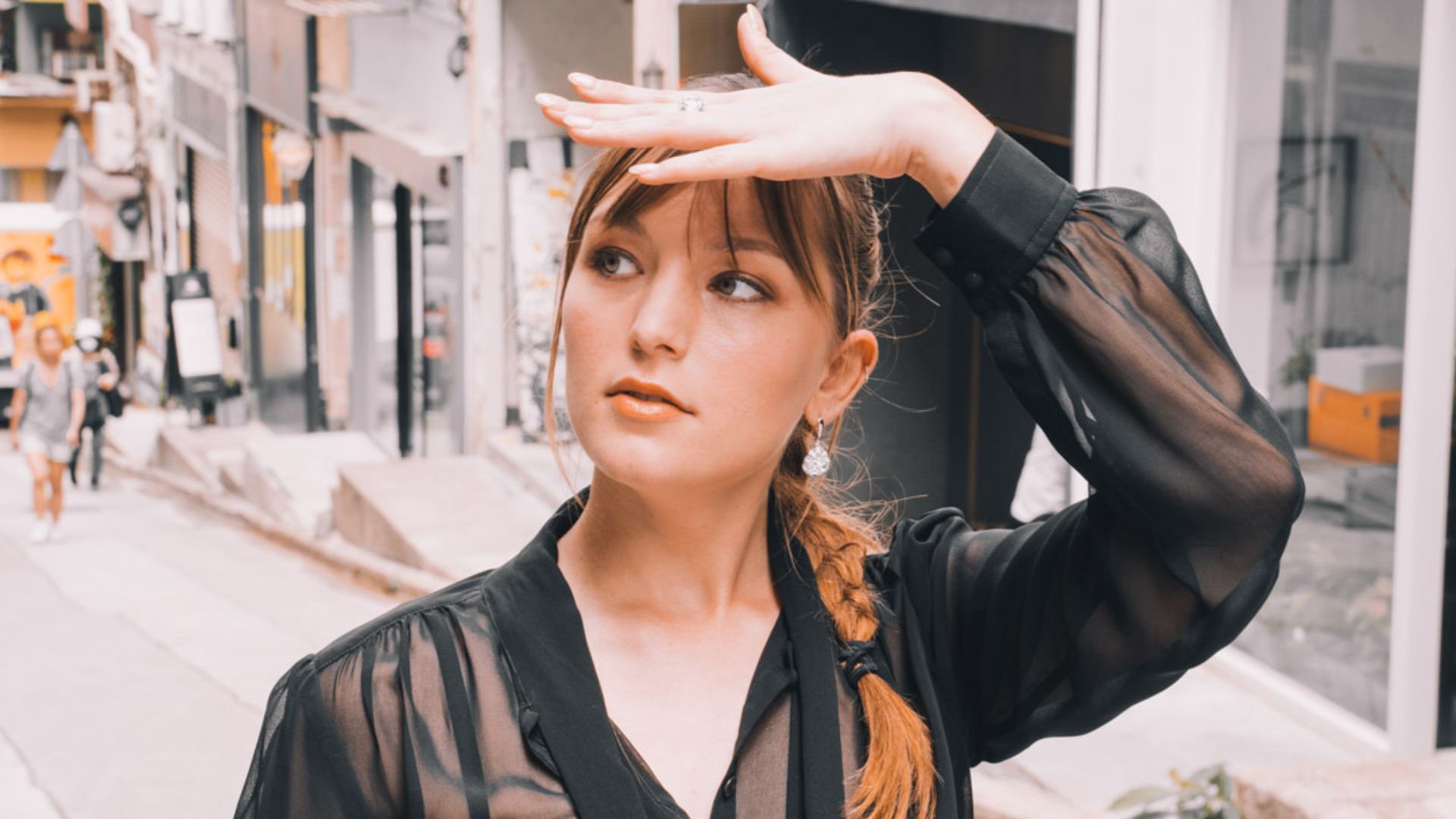 A person holding her hand to her forehead

AI-generated content may be incorrect.