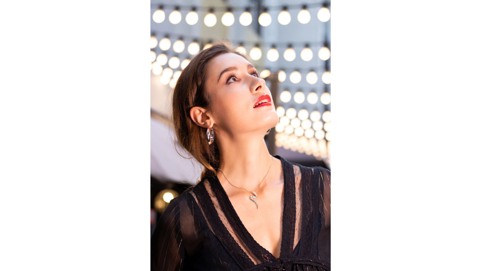 A person looking up to the sky
Description automatically generated