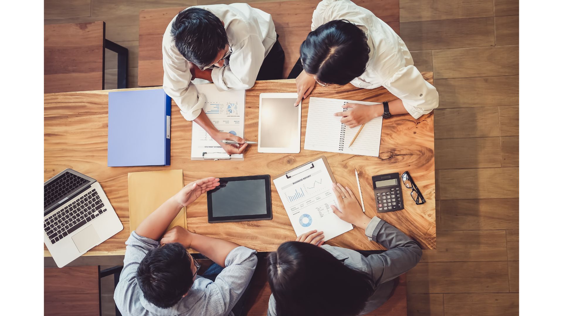 A group of people sitting around a table

AI-generated content may be incorrect.
