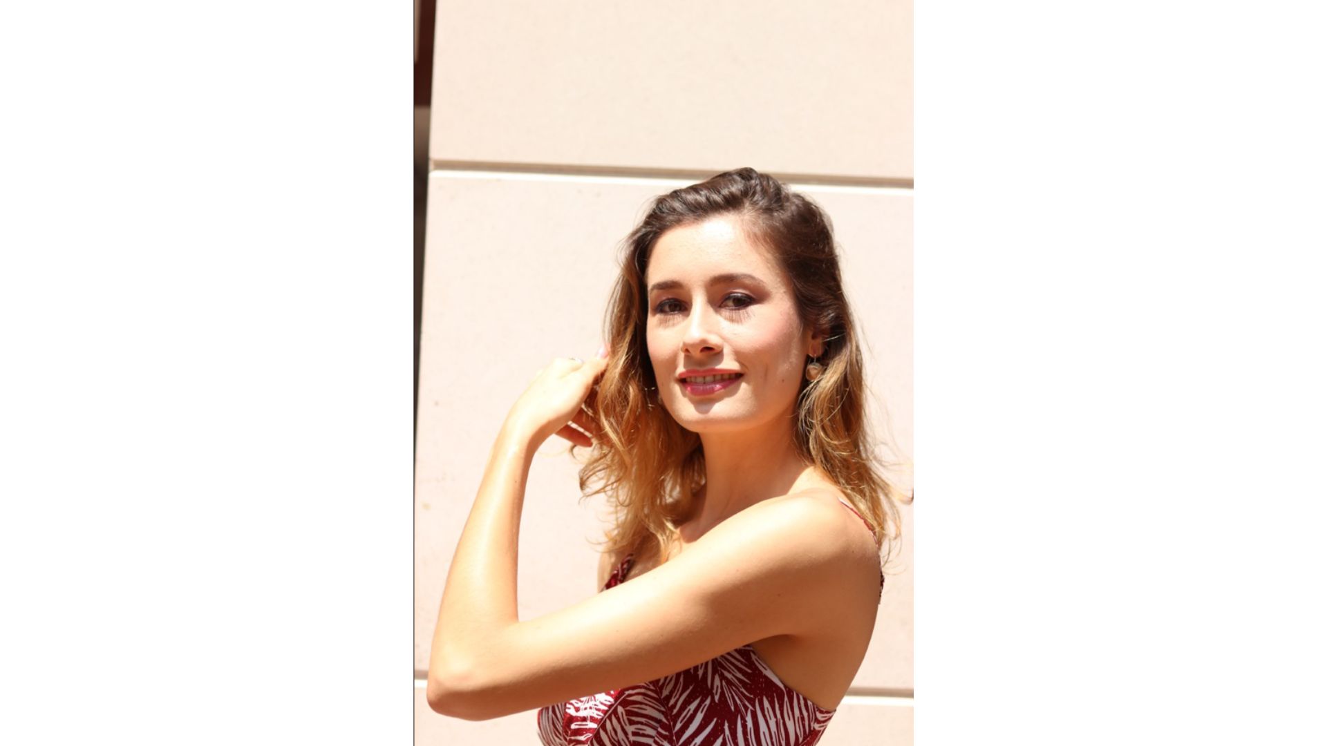 A person posing for a picture

Description automatically generated