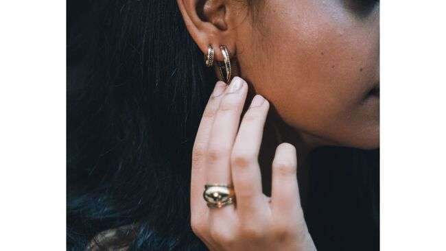 A close-up of a person's ear

Description automatically generated