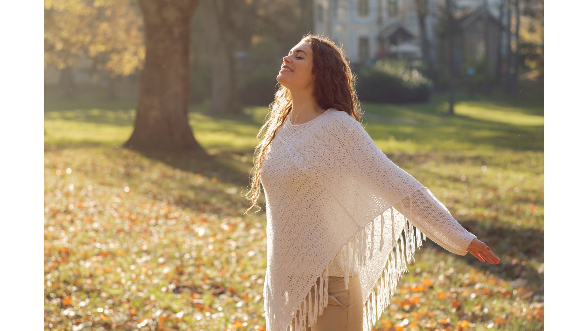 A person in a white poncho
Description automatically generated