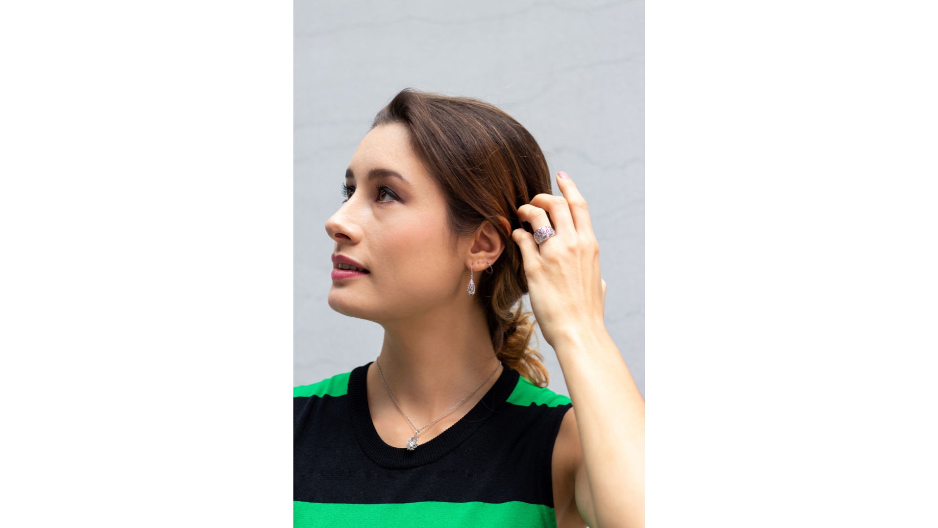 A person in a green and black striped shirt
Description automatically generated