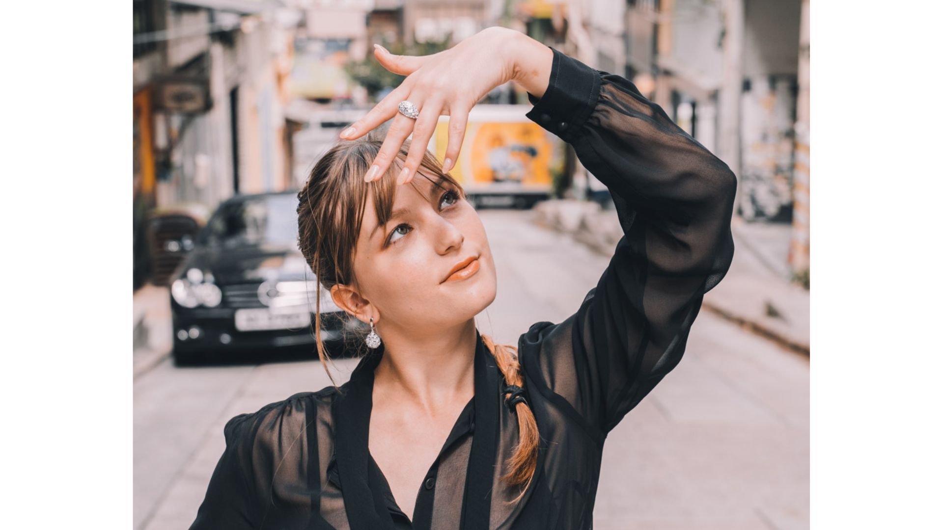 A person holding her hand up to her forehead

AI-generated content may be incorrect.