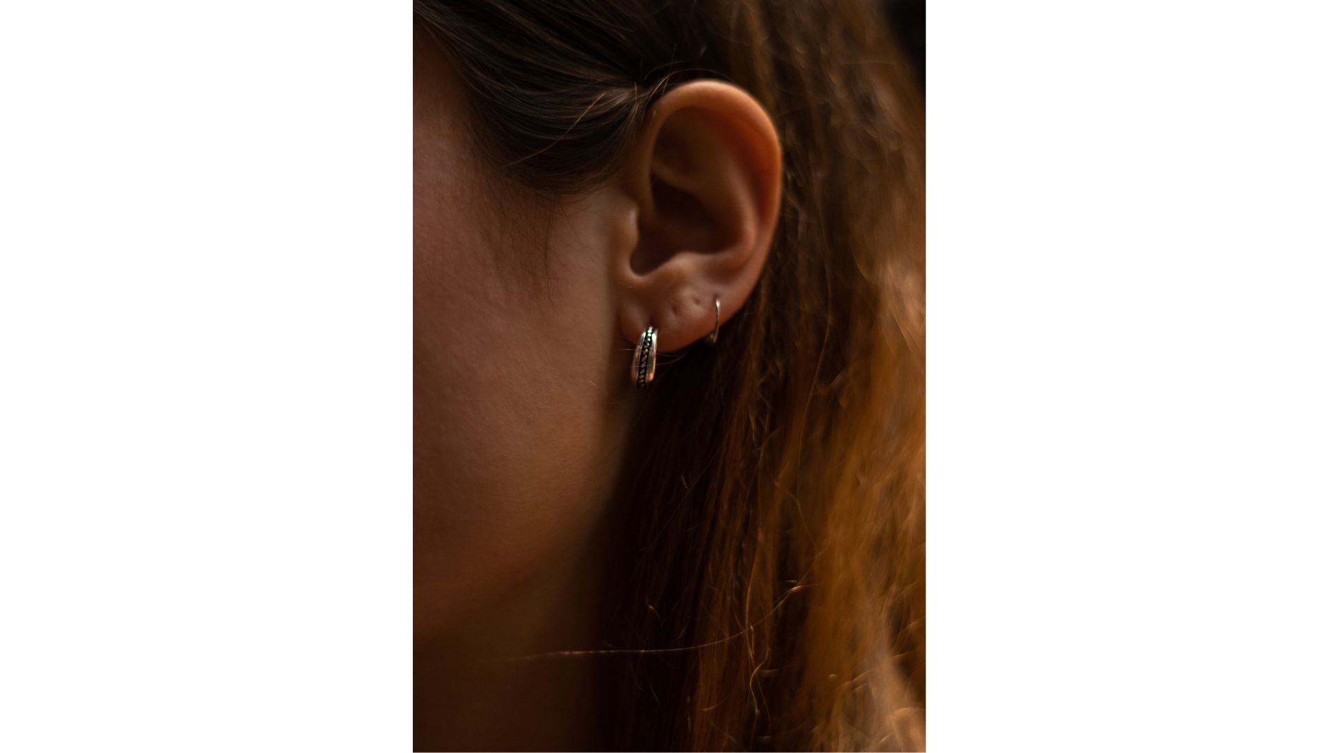 A close-up of a person's ear
Description automatically generated