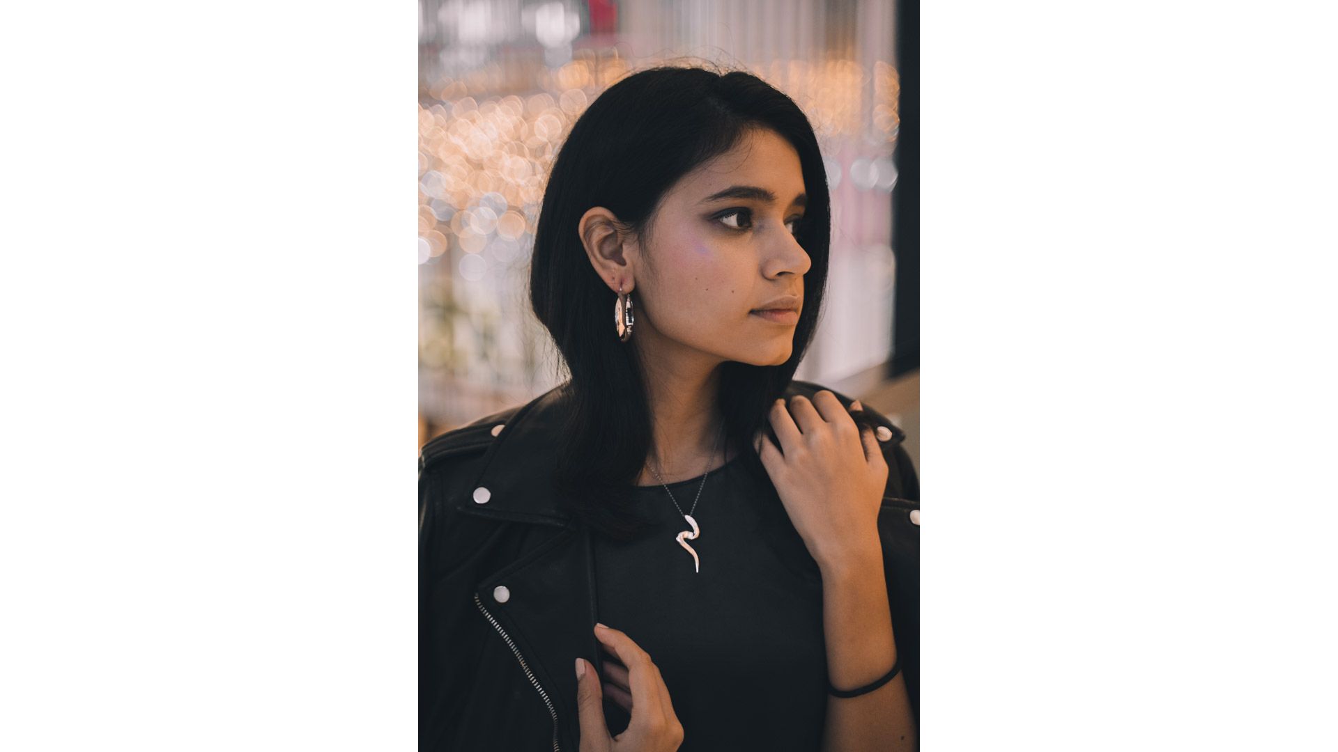 A person looking away from the camera
Description automatically generated