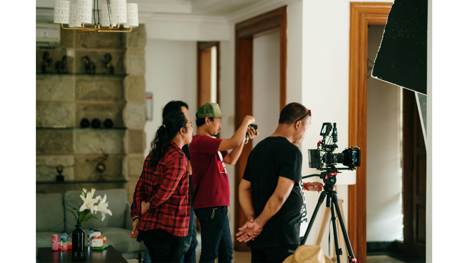 A group of people standing in a roomundefinedundefinedAI-generated content may be incorrect.