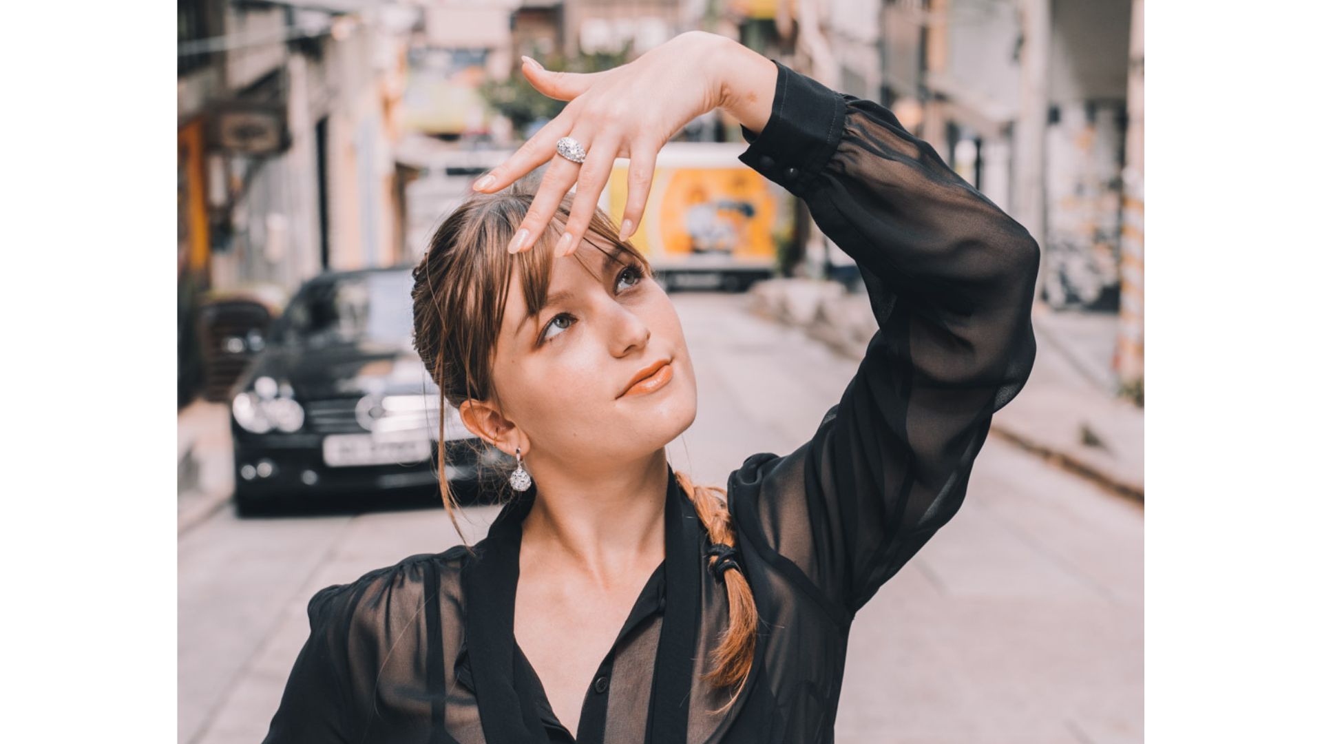 A person holding her hand up to her forehead

AI-generated content may be incorrect.